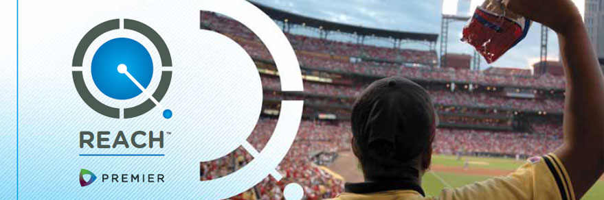 Image showing the REACH™ logo superimposed over a vendor holding up food at a sports stadium.